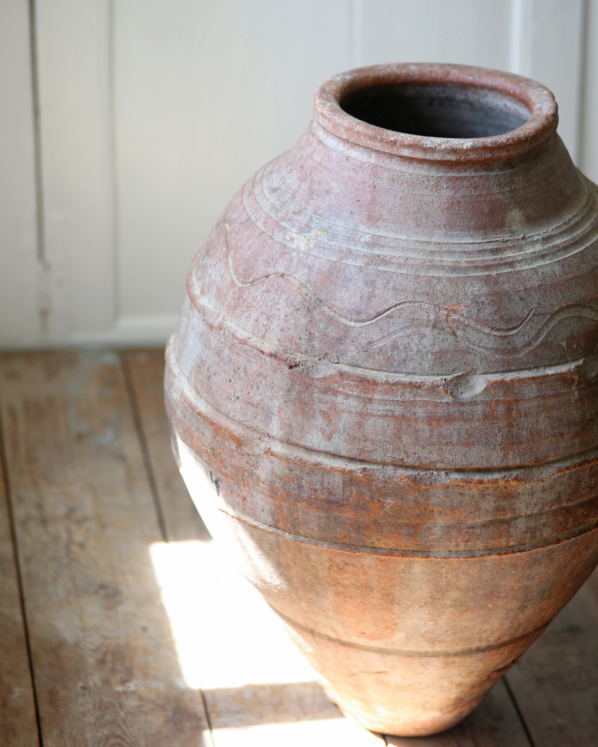 Original artisan decorative pattern on large antique olive pot 