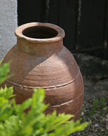 Close up of artisanal rib banding detail on old antique olive pot