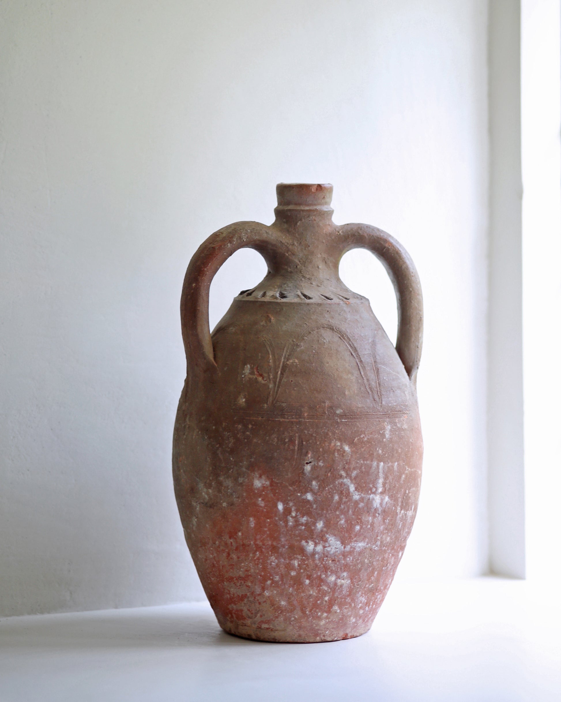 Decorative antique Turkish amphora with two curved handles