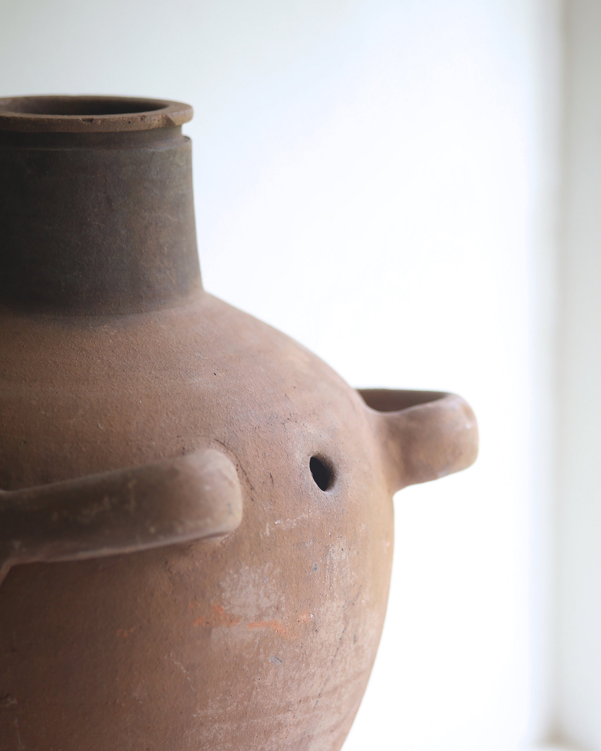 Close up showing rustic details of vintage terracotta pot