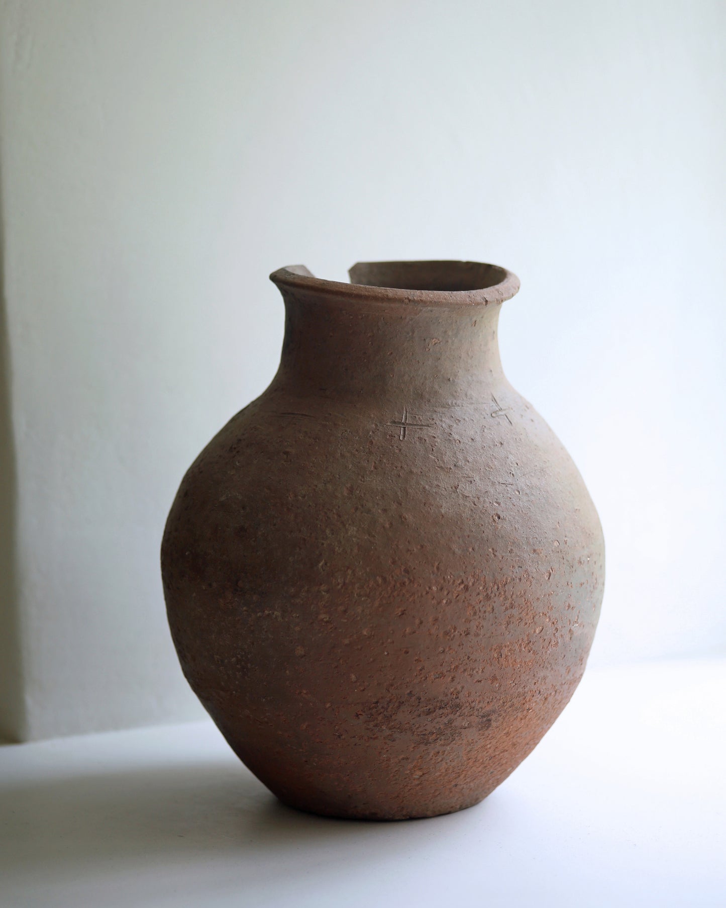 Wabi sabi style dark antique display pot