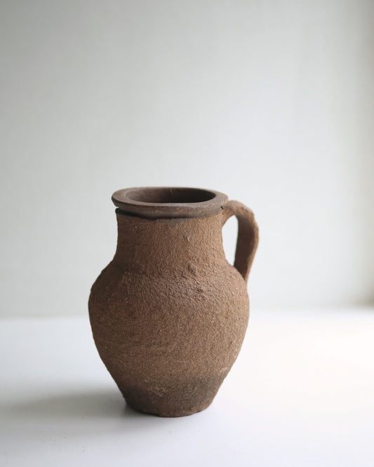 Tiny rustic terracotta bud vase