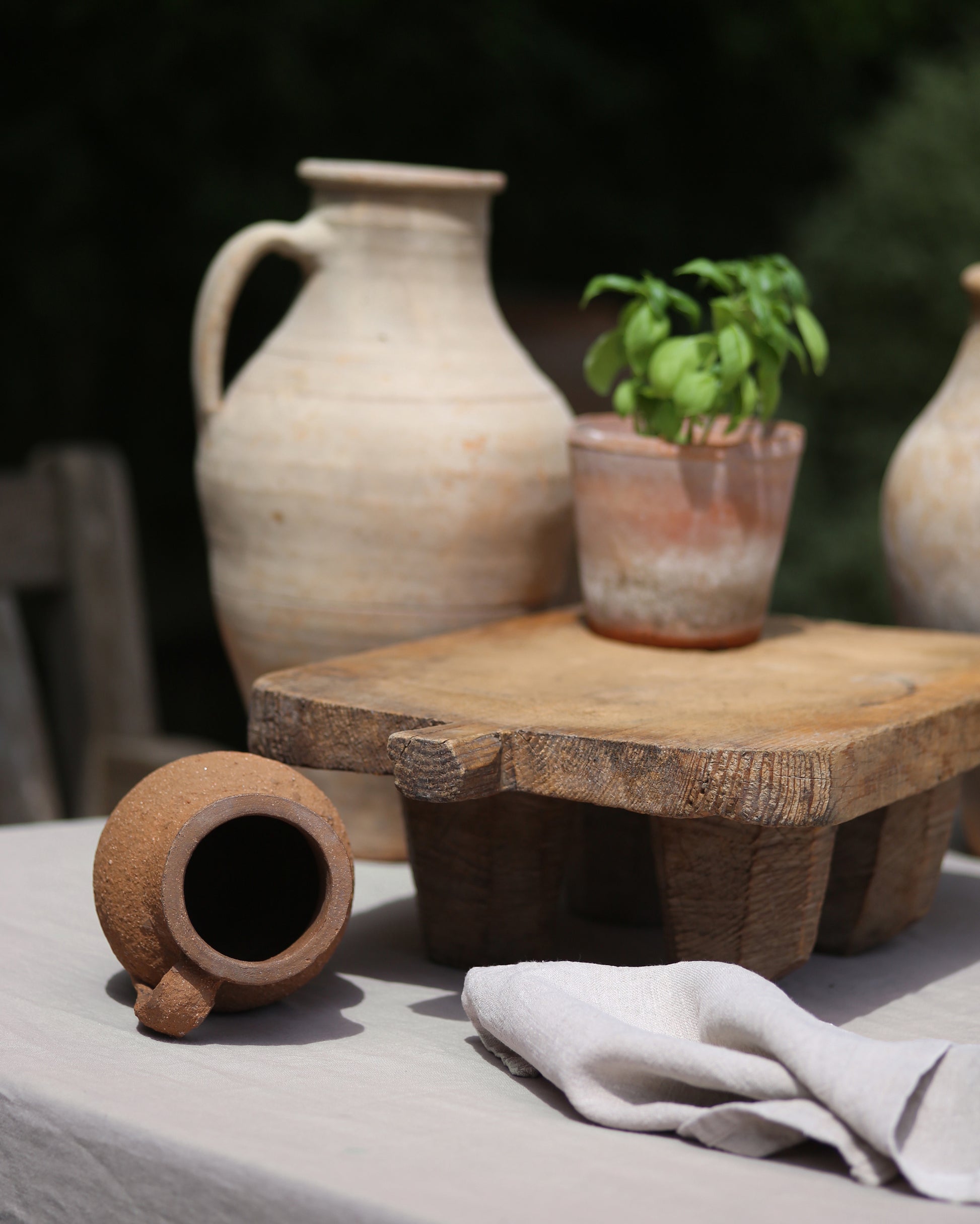 Rustic olive pots and serving boards for al fresco summer hosting