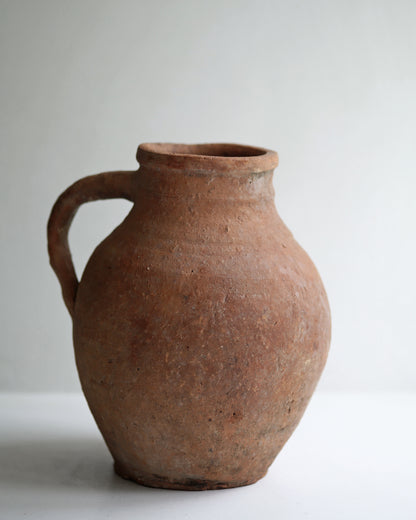 Antique aged and rustic finish of clay pottery jug