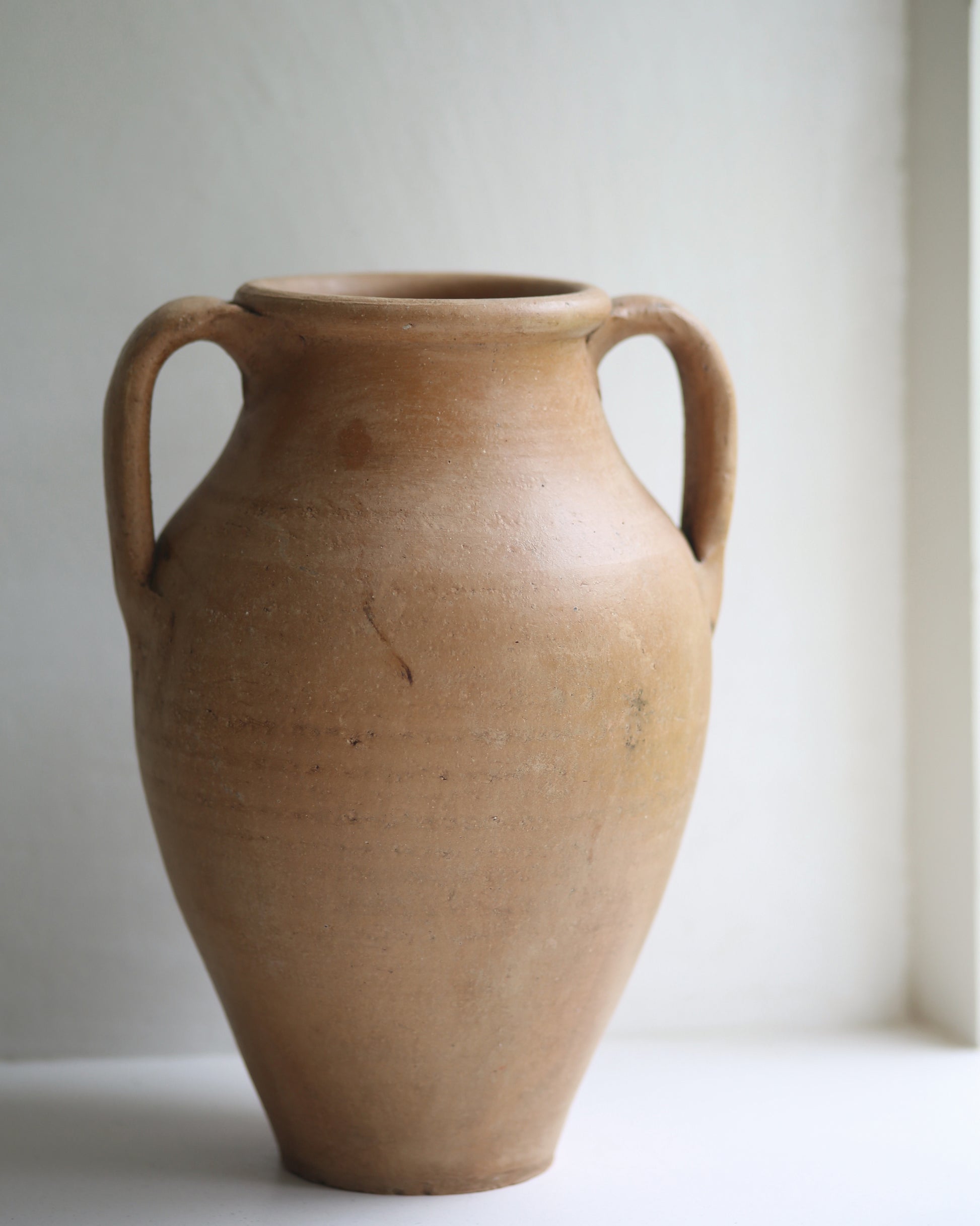 Vintage glazed terracotta vase in classic urn shape