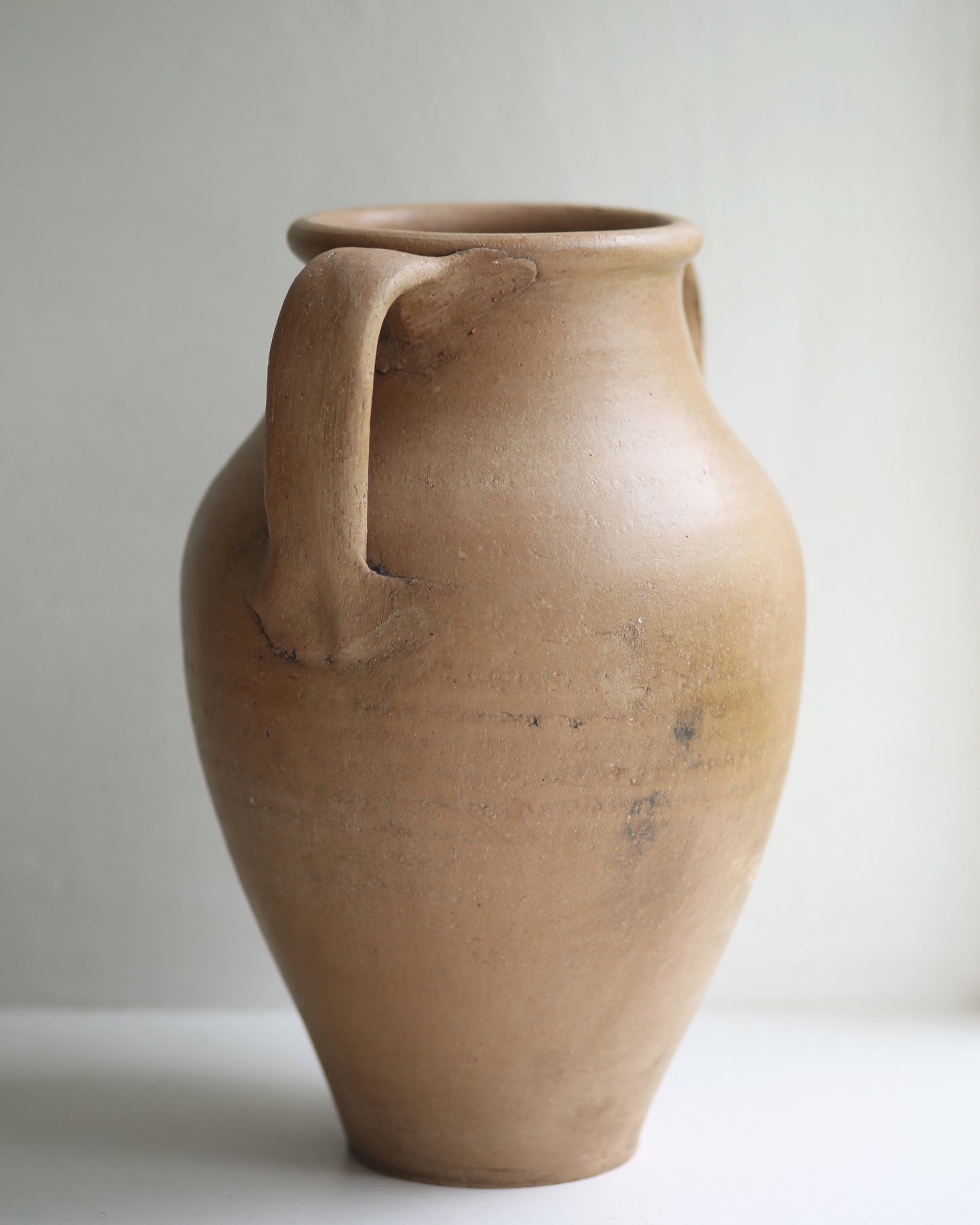 Artisan made terracotta pot with rustic handle details