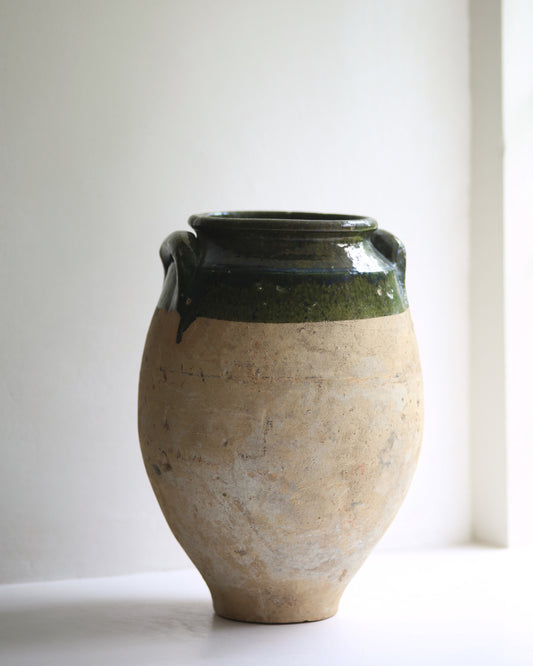 Traditional confit pot from Turkey with olive green glaze