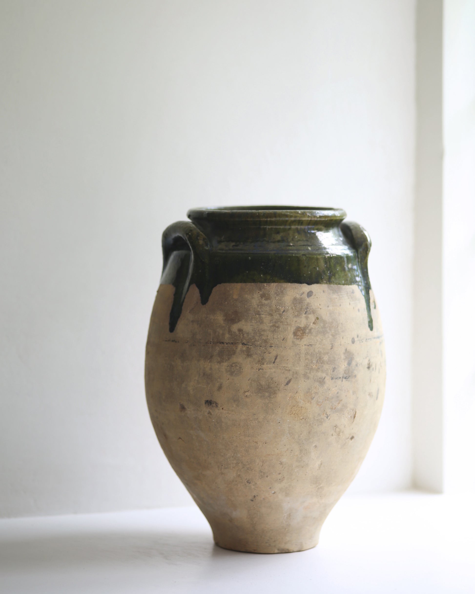 Classic antique confit pot in pale terracotta with olive green glaze