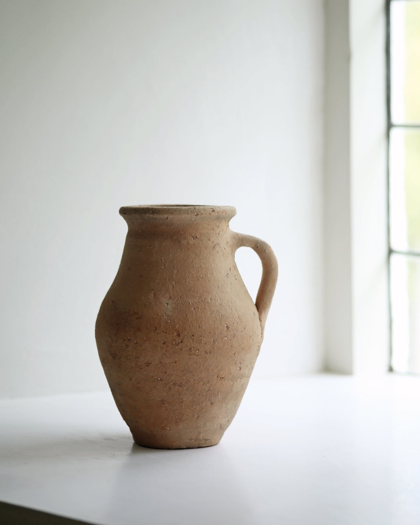 Antique pitcher pot with handle for kitchen display