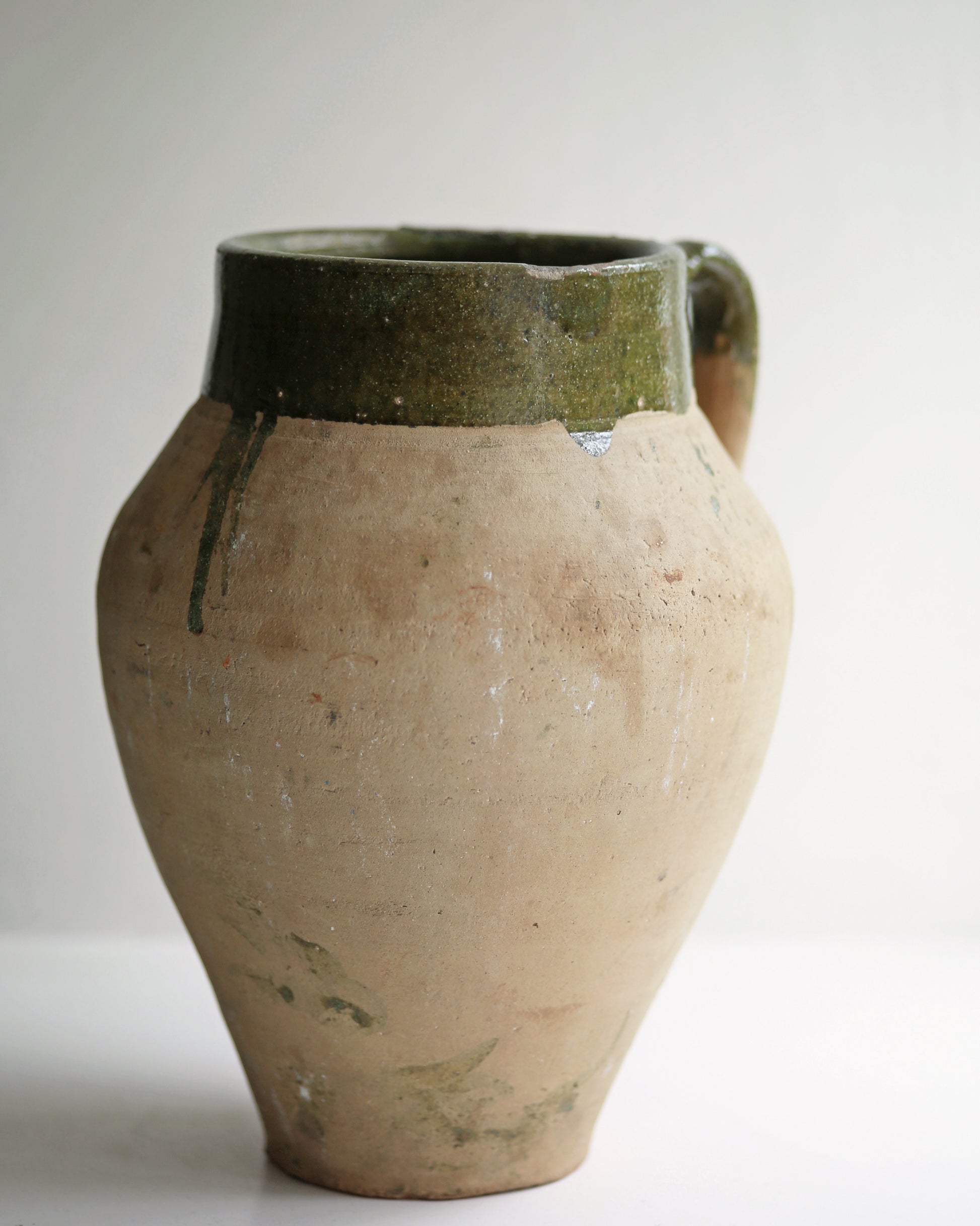 confit style green glazed pale terracotta pot