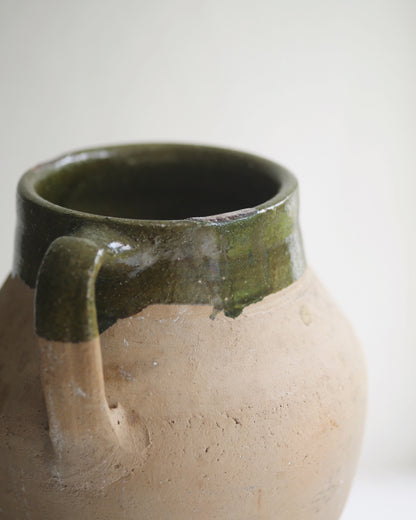 Close up of green rimmed terracotta pot