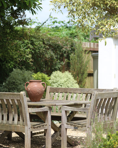 Rustic antique terracotta pot as garden decor