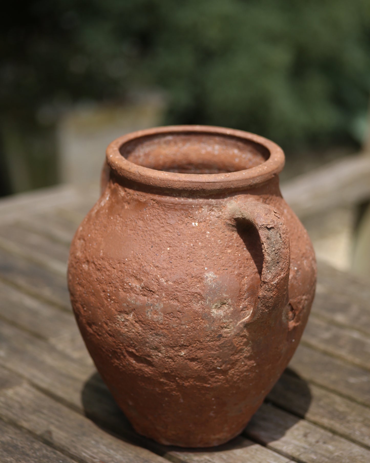 Rustic Turkish pot as garden table centrepiece