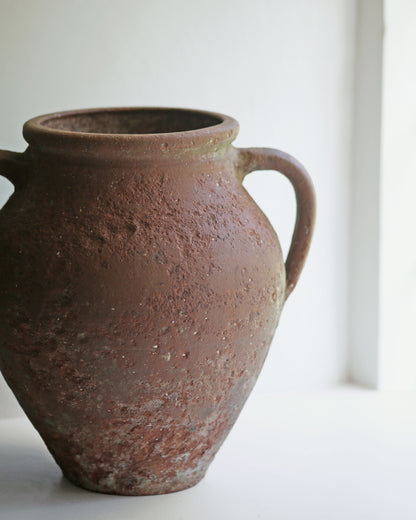 Close up of textured terracotta vase