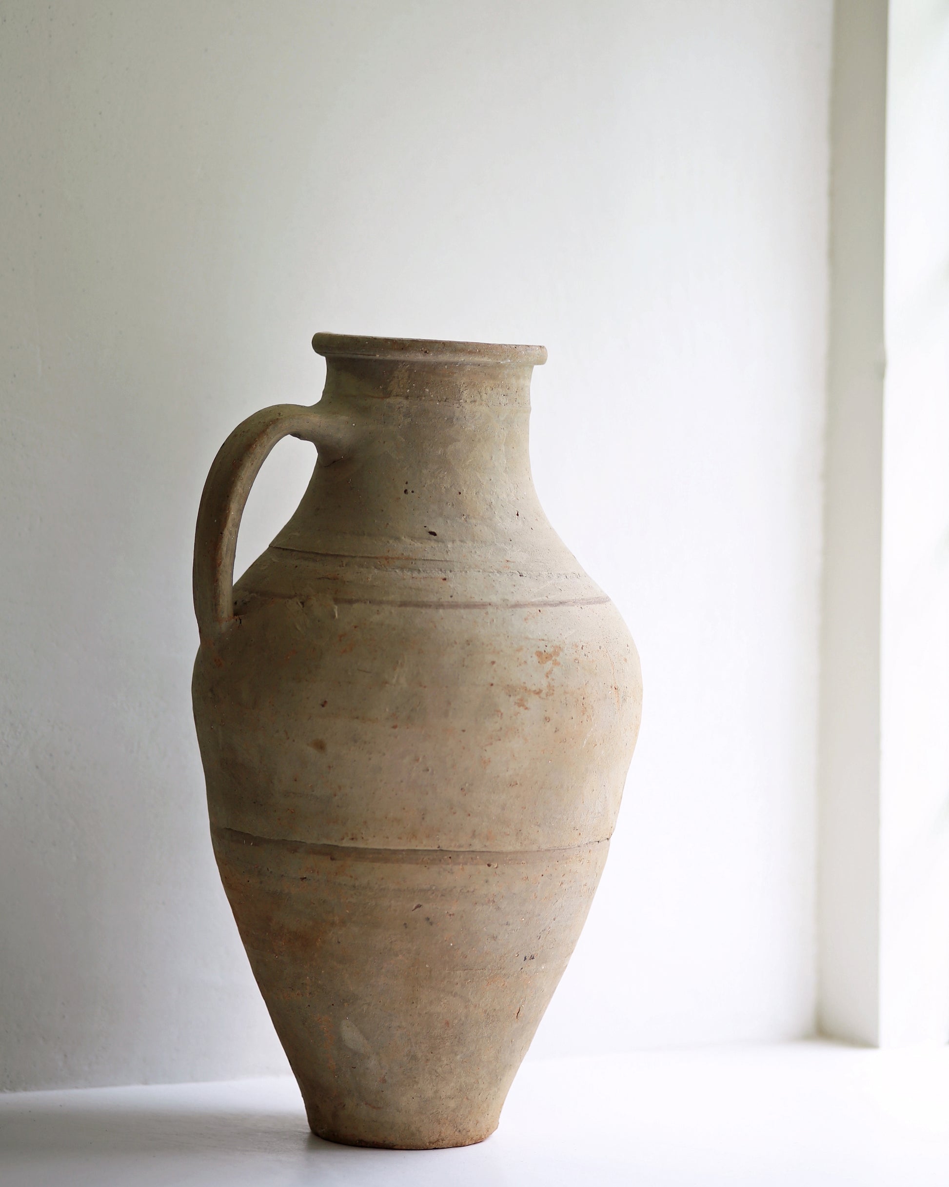 Turkish amphora pot displayed on a sunny window sill