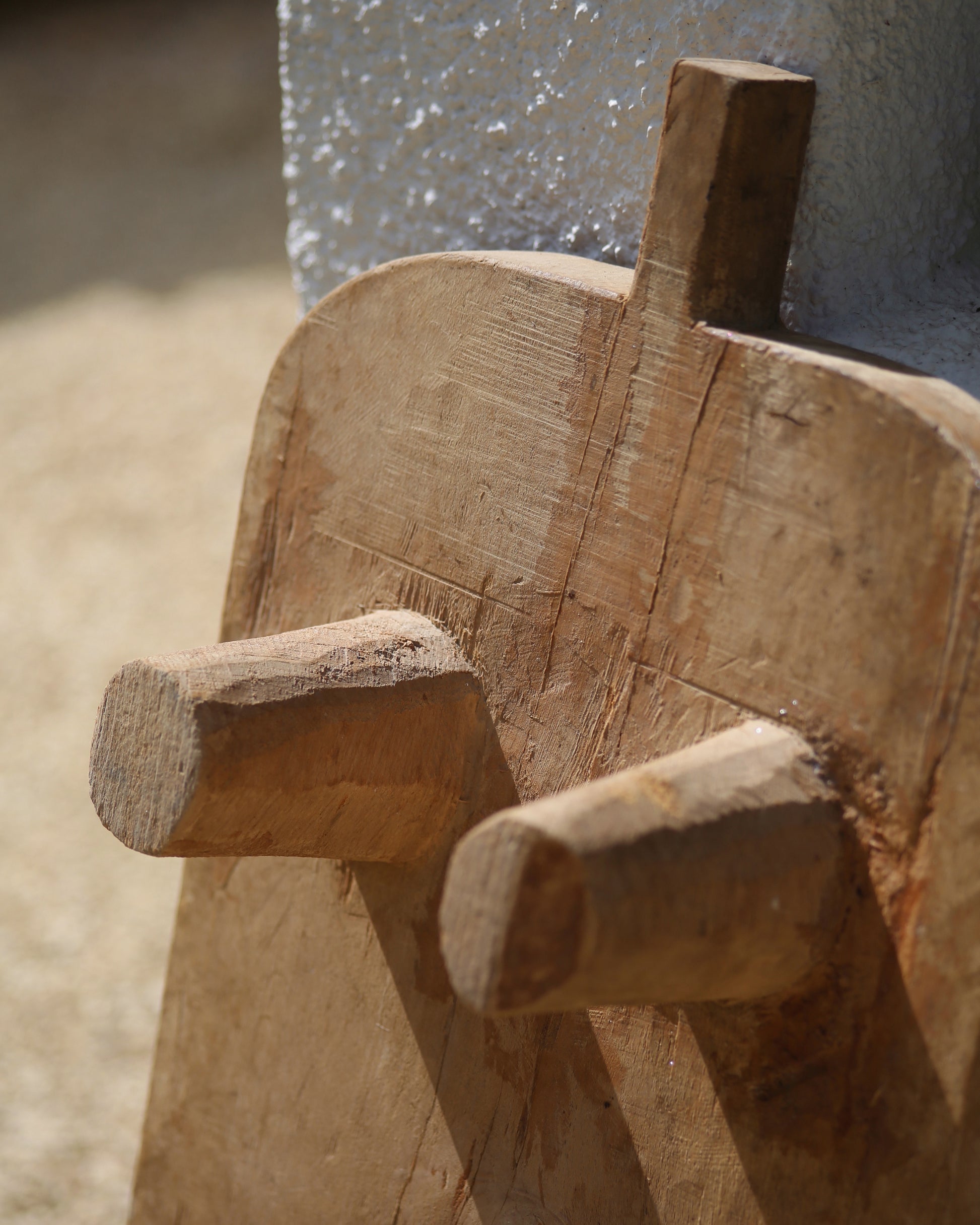 Rustic wooden legs of raised serving platter board