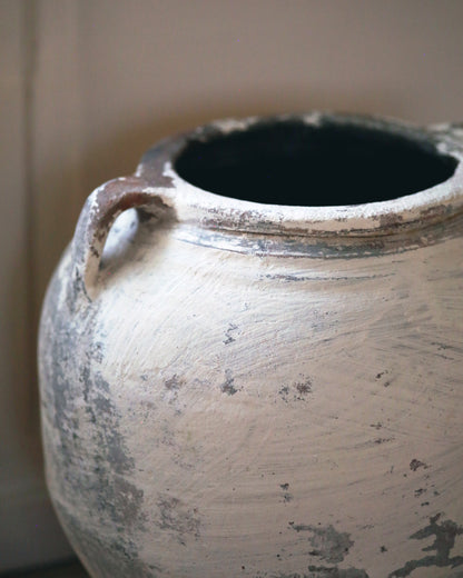 Close up of textured whitewash pot