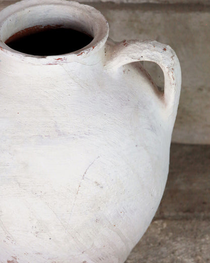 Detail of handle on white painted Turkish urn