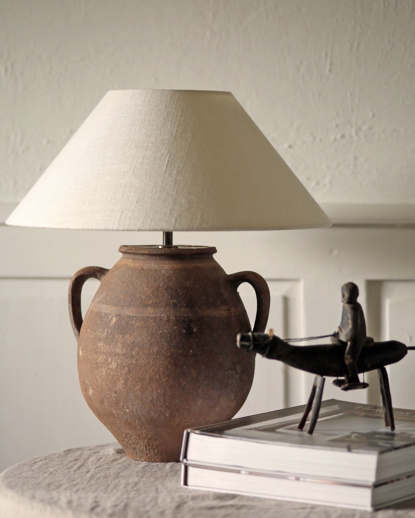 Antique clay lamp styled with antique homewares