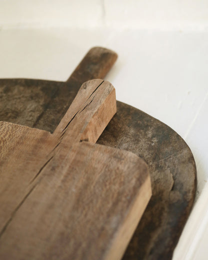 Dark wood chopping board and pale chunky board for kitchen display